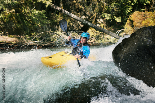 Young man canoeing  photo