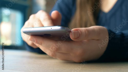 Woman using smartphon for work or shopping in ethernet shops. Close up 4k footage.