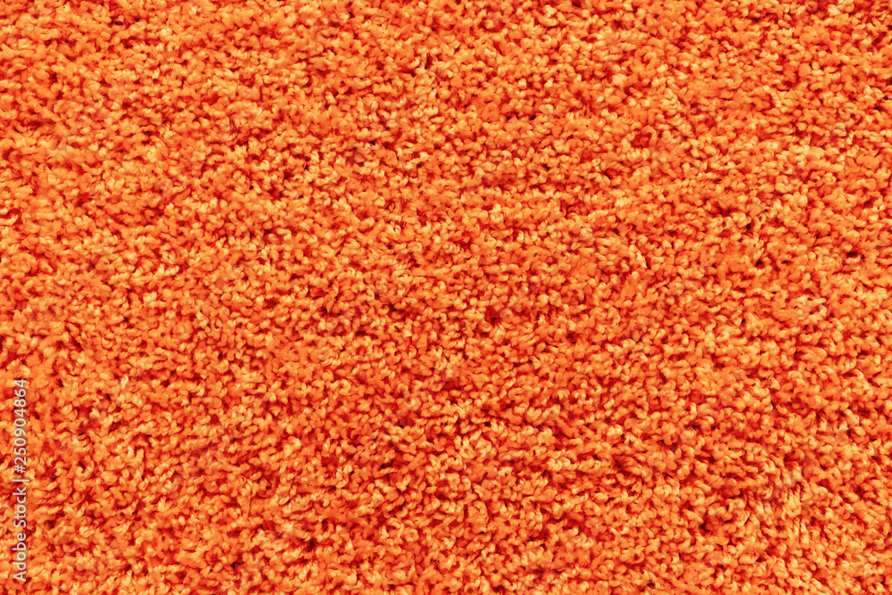 Texture of a orange carpet with a large naps. Texture of a orange carpet with a large naps.