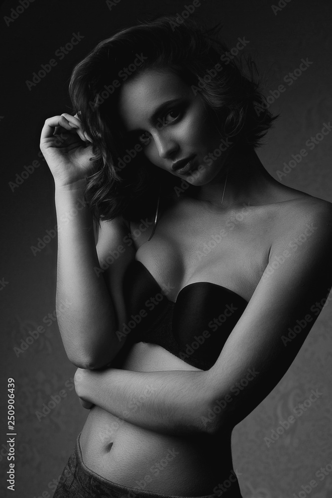 Fototapeta premium Black and white portrait of gorgeous brunette model wearing lingerie
