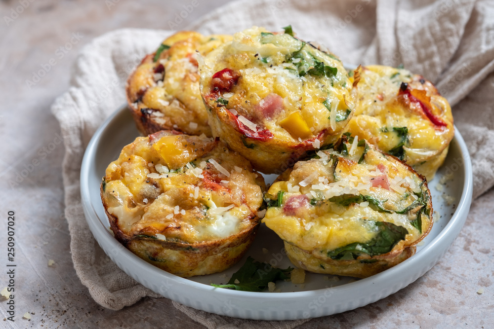 Delicious egg muffins with ham, cheese and vegetables Delicious egg muffins with ham, cheese and vegetables