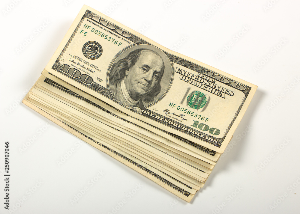 Bundle of hundred dollar banknotes on a white background Bundle of hundred dollar banknotes on a white background