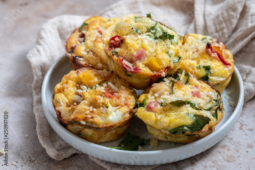 Delicious egg muffins with ham, cheese and vegetables