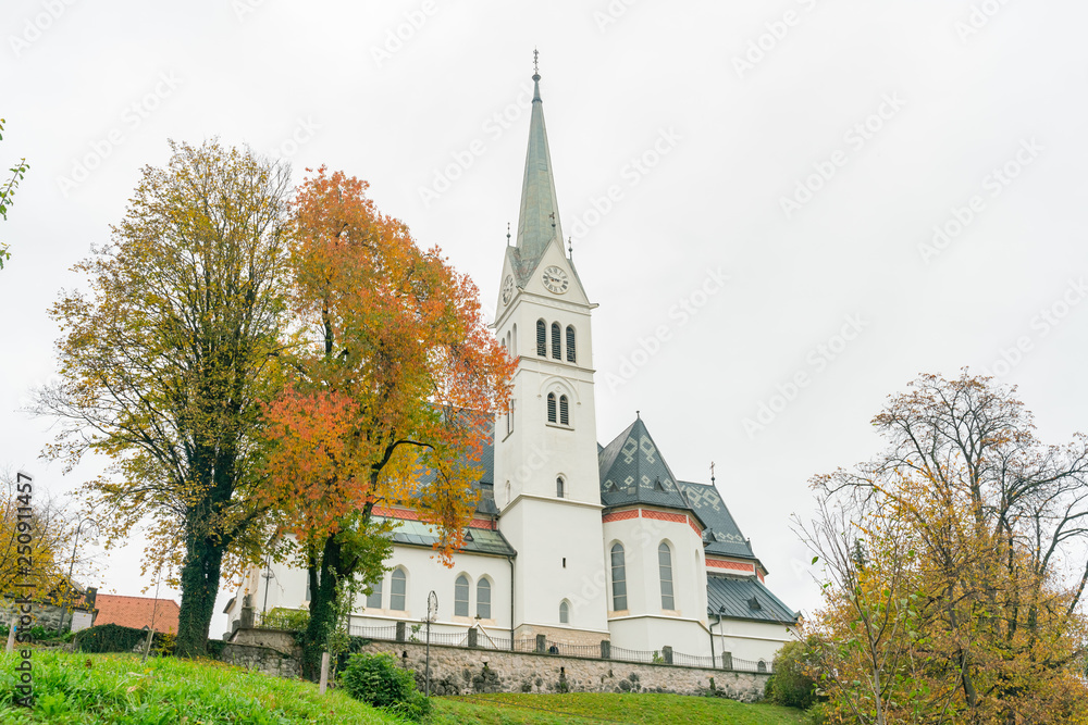 Beautiful autumn landscape around Lake Bled with St. Martin's Parish Church