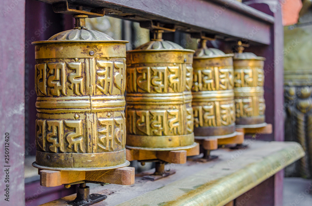 Brass Buddhist prayer wheels, Kathmandu, Nepal. Brass Buddhist prayer wheels, Kathmandu, Nepal.