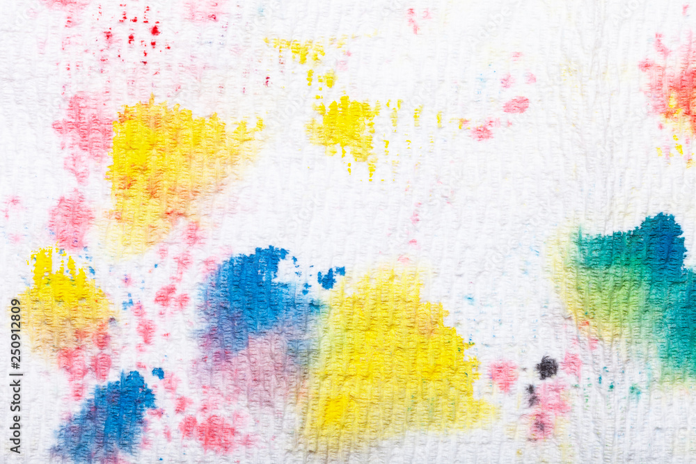An abstract pattern created from paint daubs on a paper kitchen towel
