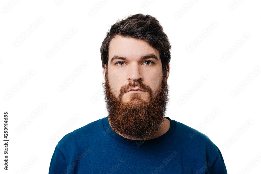 Close up horizontal portrait of a serious man with beard isolated on white background Close up horizontal portrait of a serious man with beard isolated on white background