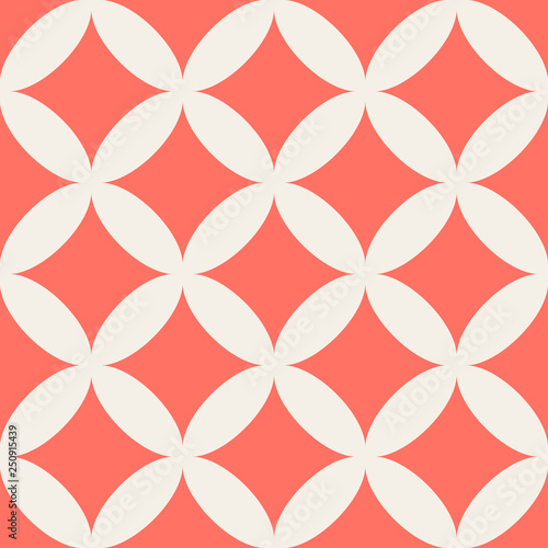 Seamless geometric pattern of circles on a coral background. Simple geo pattern. Clothing fabric print, wrap paper textile. Living coral. 2019 color