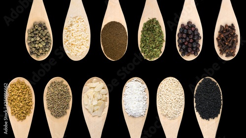Set of various spices and food ingredients isolated on black background. High resolution