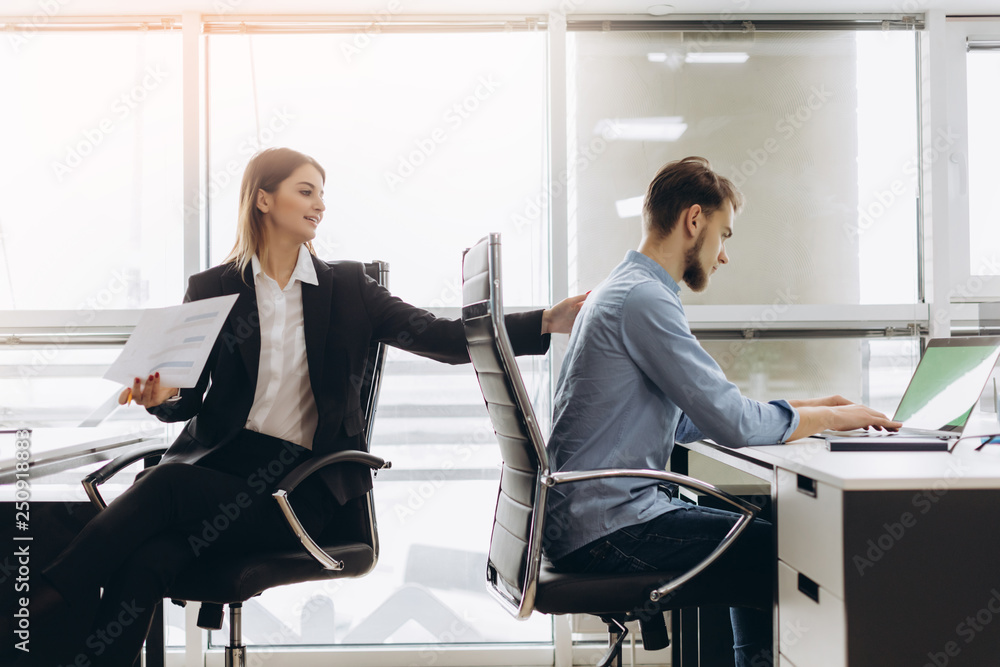 Young personal assistant giving document to office worker in his office, female accountant reporting great work to ceo, junior manager showing to executive increased financials, project stats on paper Young personal assistant giving document to office worker in his office, female accountant reporting great work to ceo, junior manager showing to executive increased financials, project stats on paper