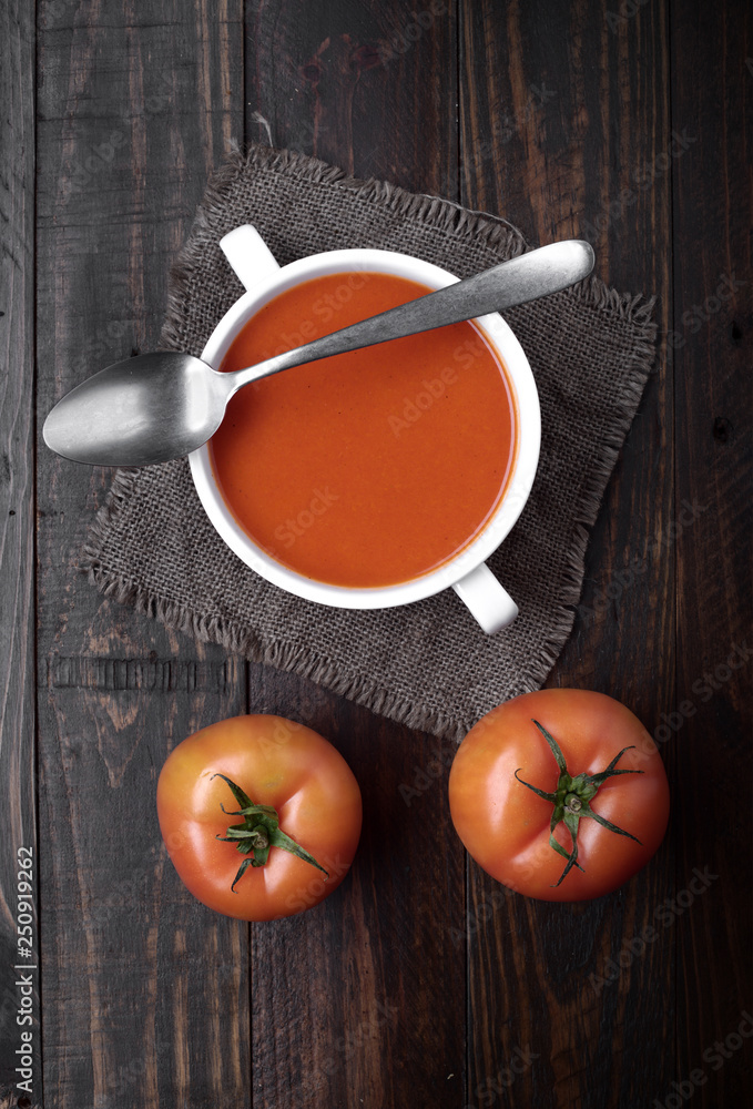 bowl of tomato sauce with spoon on rustic wood with natural light bowl of tomato sauce with spoon on rustic wood with natural light
