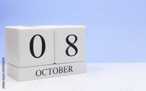 October 08st. Day 8 of month, daily calendar on white table with reflection, with light blue background. Autumn time, empty space for text © Egor