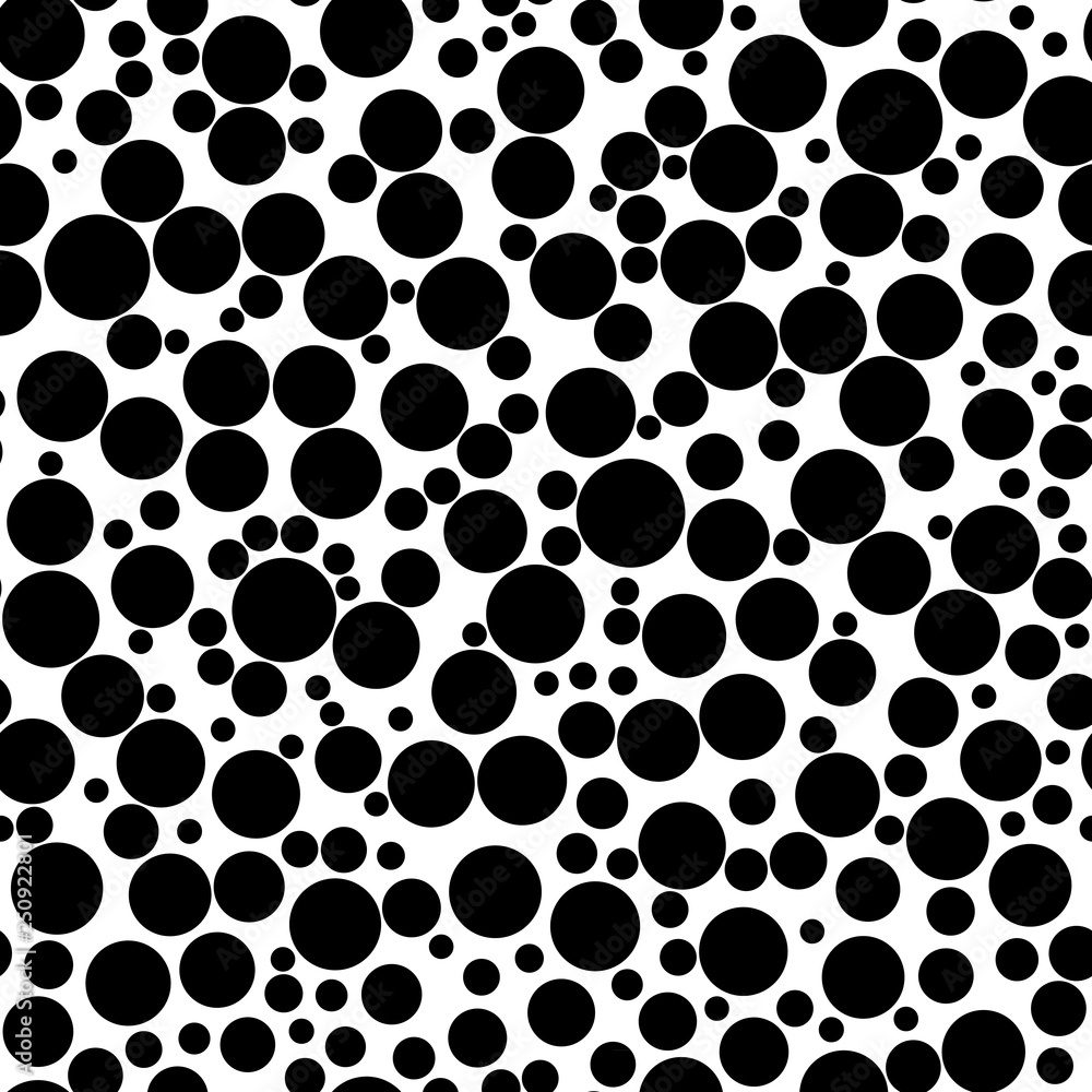 Abstract seamless pattern of circles of different sizes in black and white colors Abstract seamless pattern of circles of different sizes in black and white colors