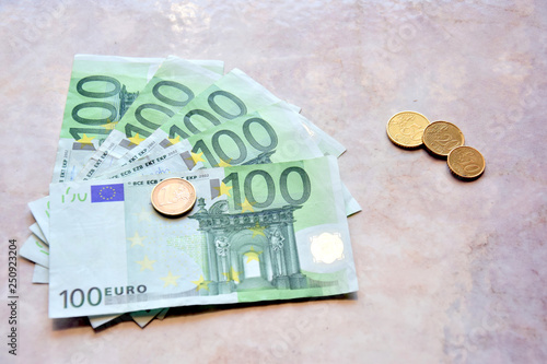 Money euro coins and banknotes on the table. photo