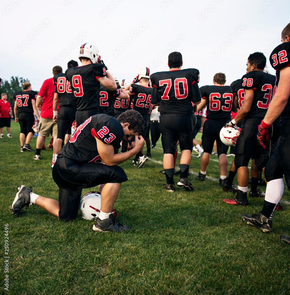Football players (14-15, 16-17) on playing field Football players (14-15, 16-17) on playing field