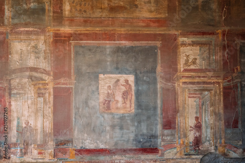 Pompeii, Italy. Ancient Frescoes In Wall Of Old Building
