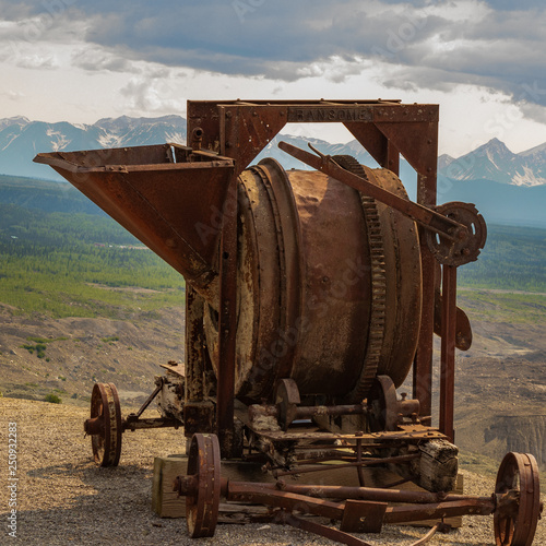 Rusty Copper Grinder abandoned at the side of the glacier at the Kennecott Copper Mine Town photo