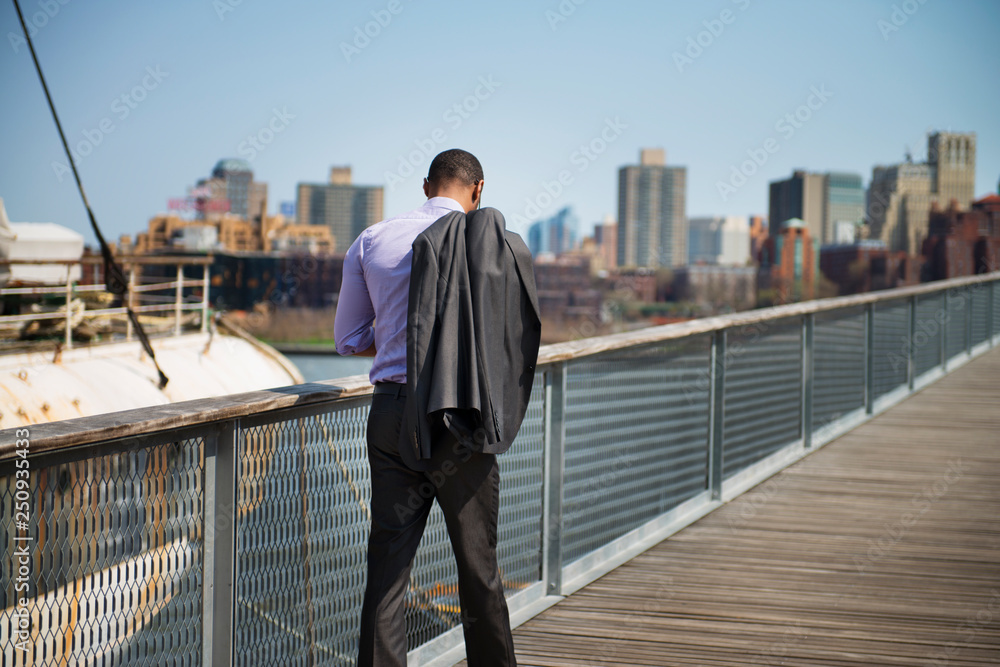 Man walking on promenade Man walking on promenade