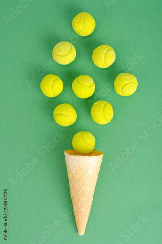 Waffle cone with yellow rubber bands on bright background