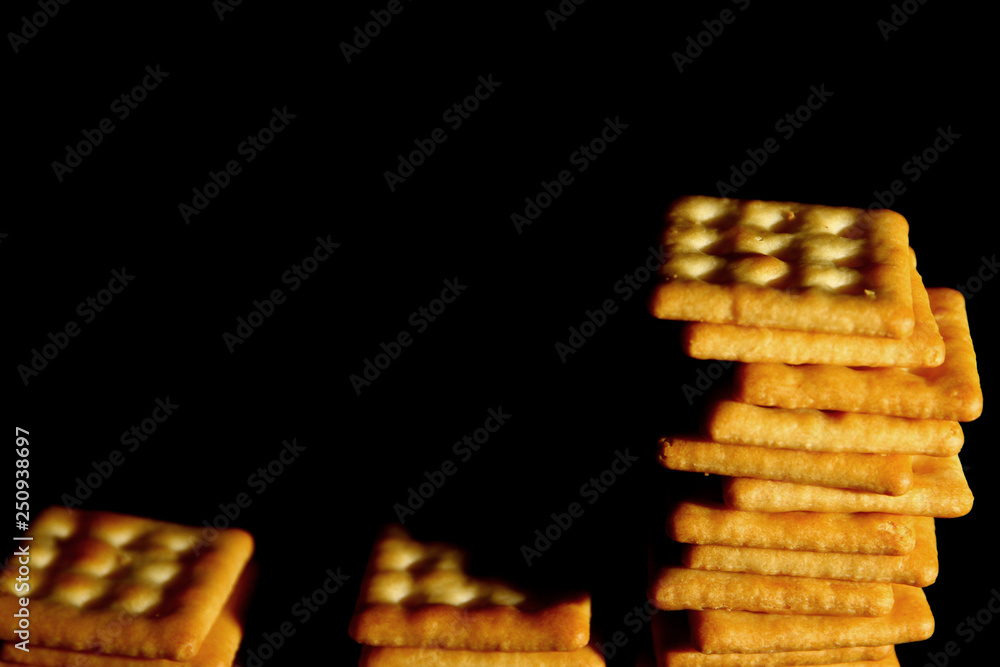 Crackers biscuit background / A cracker is a flat, dry baked food typically made with flour. Crackers biscuit background / A cracker is a flat, dry baked food typically made with flour.