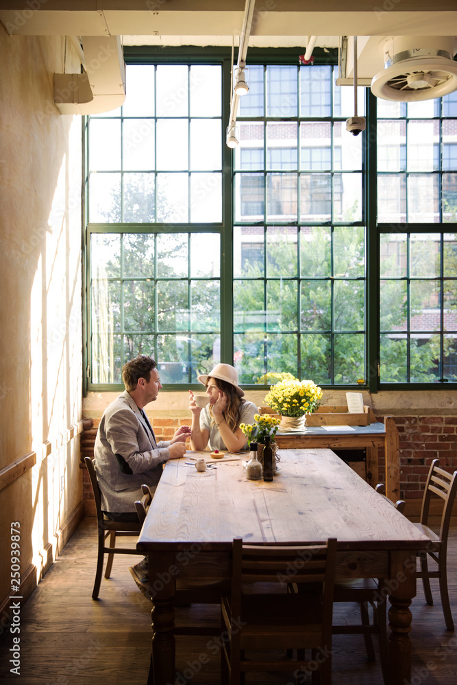 Mid adult couple dating in cafe Mid adult couple dating in cafe