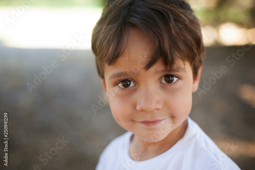 Portrait of cute boy ( 4-5 ) standing in meadow 