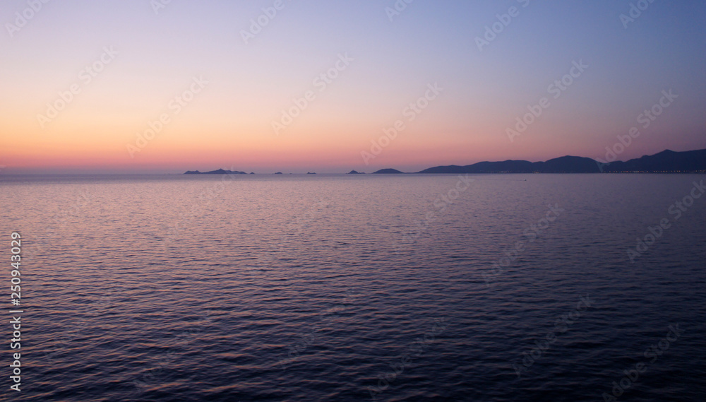 In crimson tones, or arrival to the island of Corsica late spring evening.