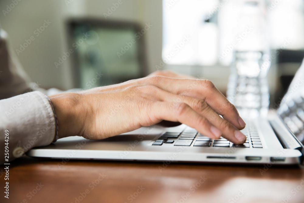 Close up of hands typing on laptop Close up of hands typing on laptop