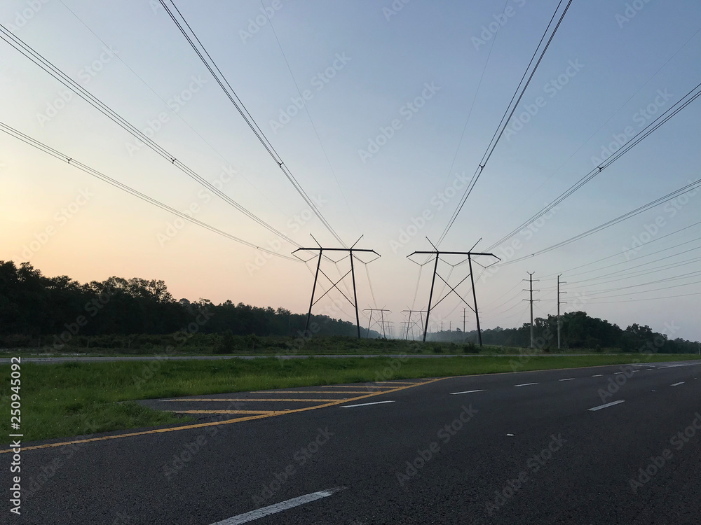 Transmission lines high voltage electrical pole structure. Photo image
