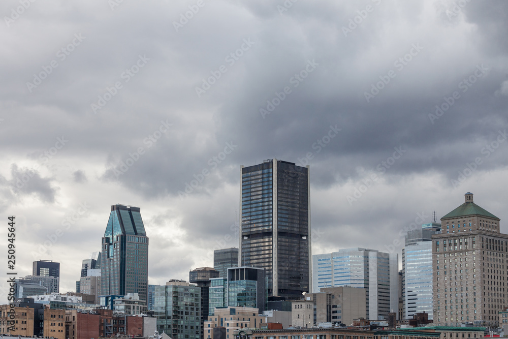 Montreal skyline, with the iconic buildings of the old Montreal (Vieux Montreal) and the CBD business skyscrapers taken from the port. 