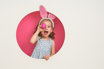 Girl with painted eggs