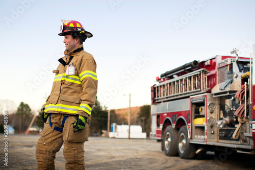 Smiling firefighter standing outdoors