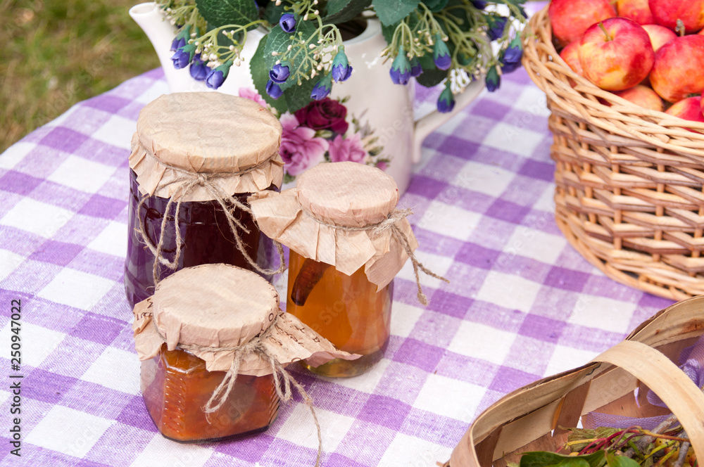 Autumn harvest: jars with jam on table