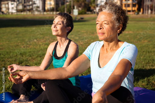 Senior women practicing yoga  photo