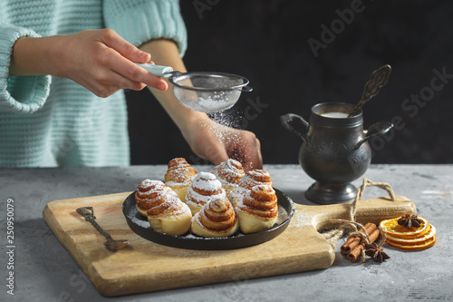 cinnamon rolls sinabon made at home, lying on a grey table. Homemade cakes photo