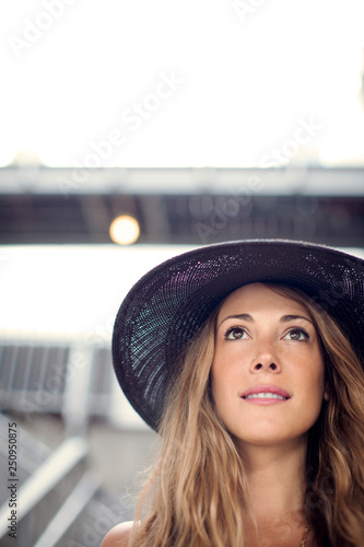 Portrait of young woman wearing hat 