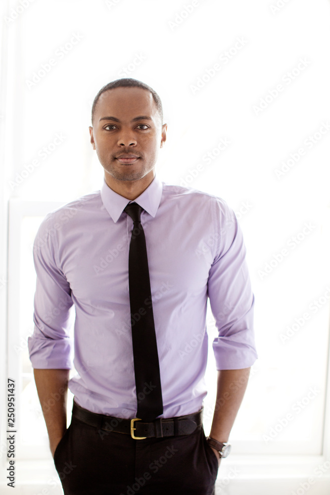 Portrait of young man with hands in pockets Portrait of young man with hands in pockets