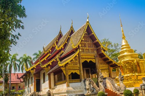 Lanna style Buddhist church at Wat Phra Singh Temple of the Lion Buddha  with blue sky background. Wat Phra Singh is an important Buddhist monastery and temple on the west side of Chiang Mai  Thailand