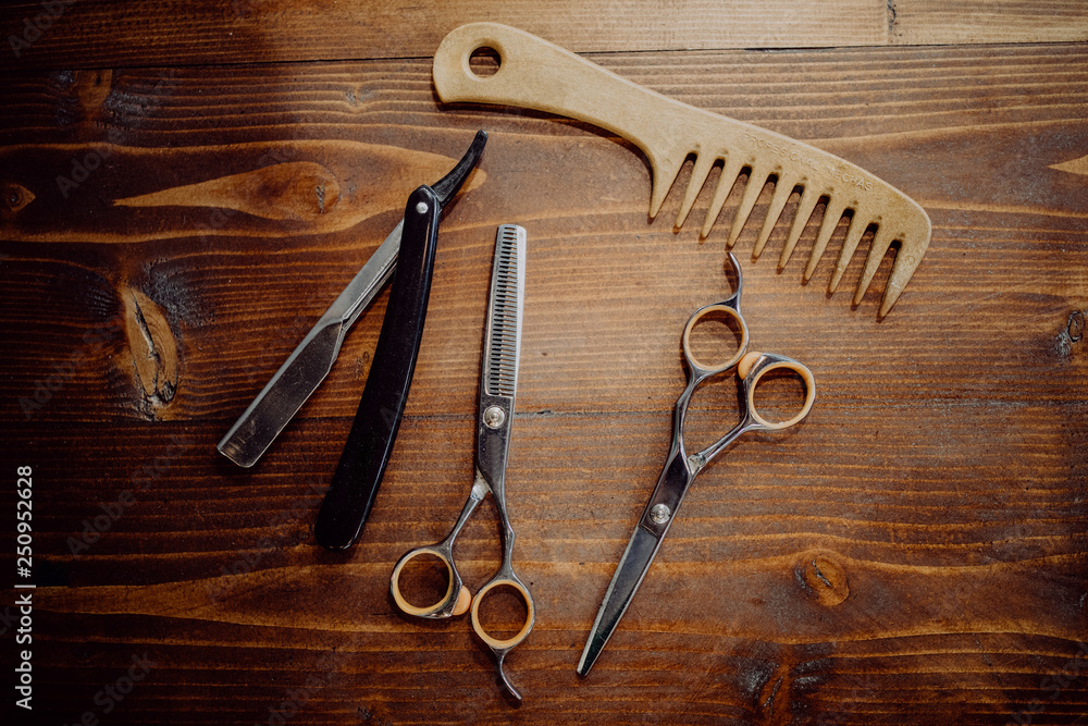 Barber equipment and tools on wood table background Barber equipment and tools on wood table background