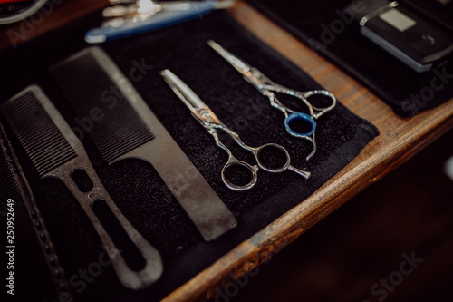 Old vintage barbershop tools on wooden tabl. Retro grooming equipment