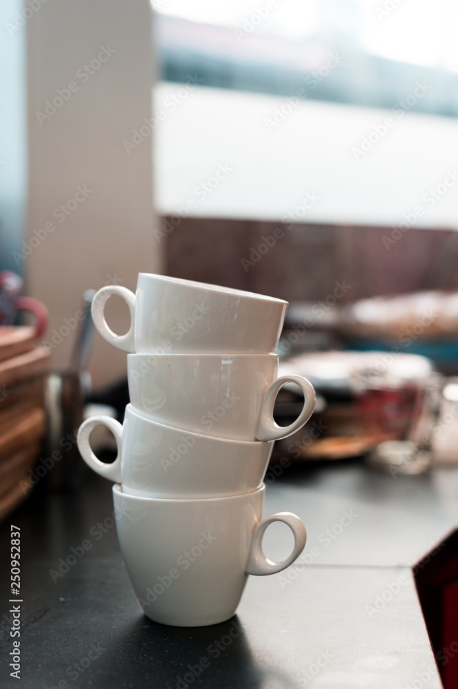 white coffee mugs stacked in mini cafe white coffee mugs stacked in mini cafe