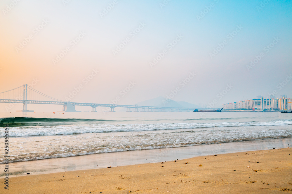 Gwangan bridge beach with colorful sunrise sky in Busan, Korea