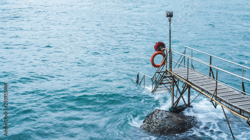 Photography A walk way of Sai wan swimming shed pier in hong kong with blue beautiful sea color