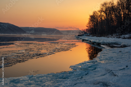 Melting ice on the river. Spring. Sunset on the Volga River