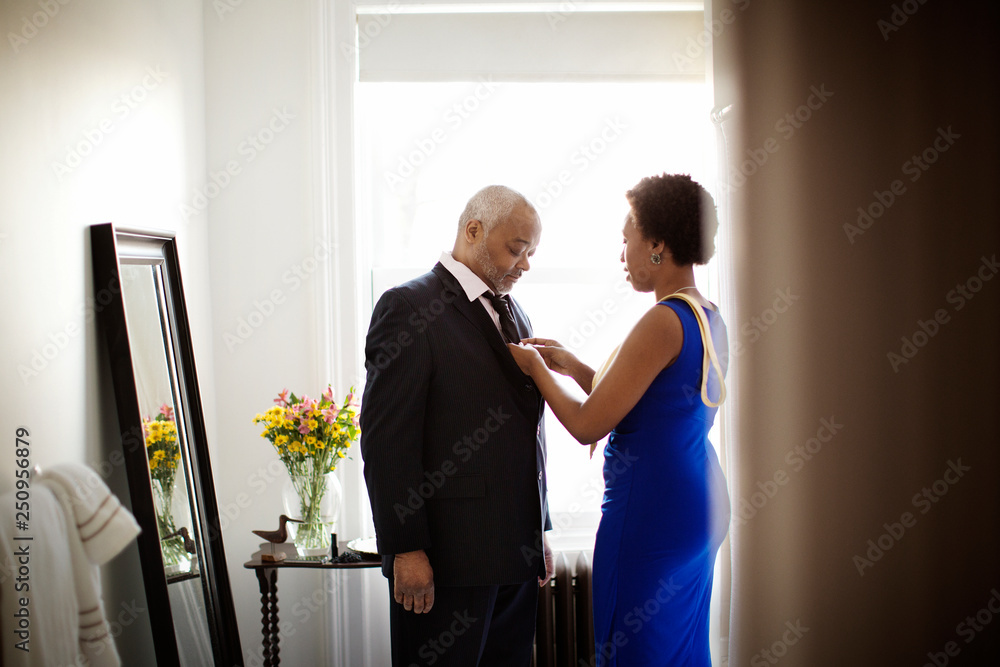 Father and adult daughter dressing in bathroom Father and adult daughter dressing in bathroom