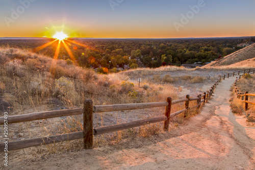Downhill foothills trail in Boise, Idaho at sunset photo