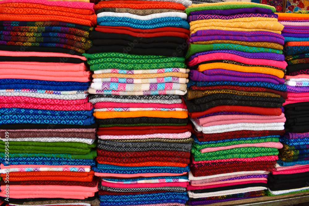 pile of colorful fabrics pile of colorful fabrics