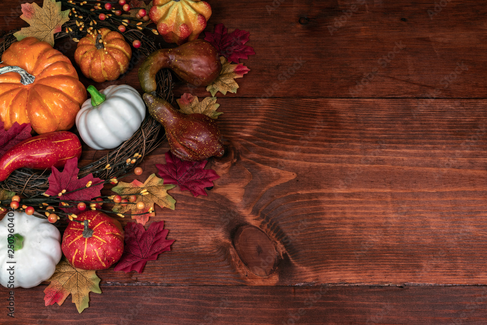 Thanksgiving decor with pumpkins, gourd, squash, maple leaves and berries Thanksgiving decor with pumpkins, gourd, squash, maple leaves and berries