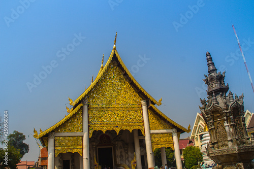 Lanna's style golden patterned background on the Buddhist church gable end. Thai golden pattern background crafted on the gable in the Buddhist temple with Lanna style at Wat Chedi Luang, Chiang Mai.