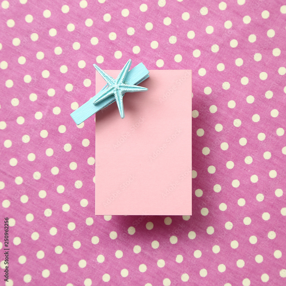Pink memo pad, sticky note on pink dot pattern fabric background Pink memo pad, sticky note on pink dot pattern fabric background